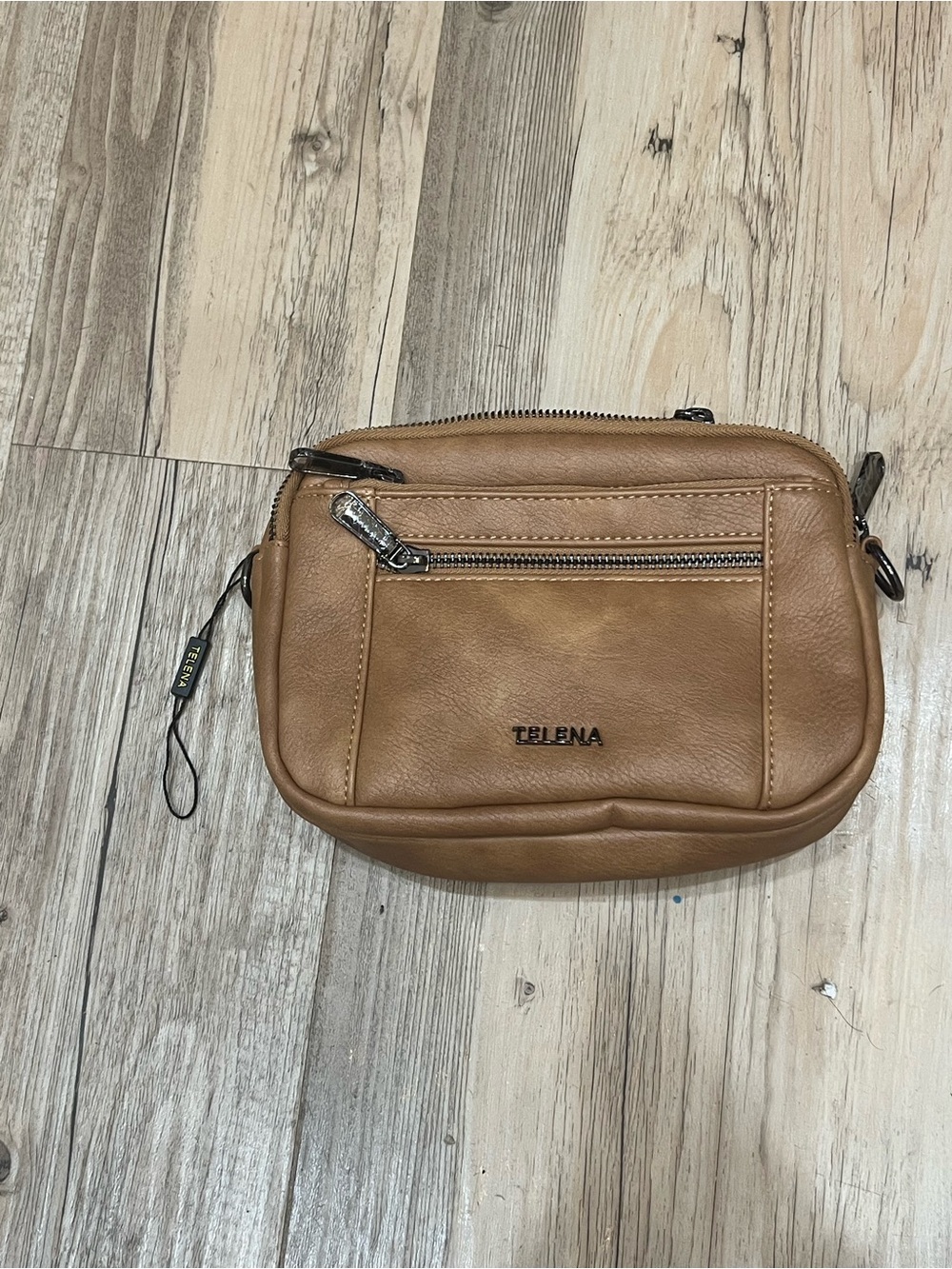 Telena small vegan leather crossbody bag in a light brown color